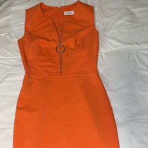 Calvin Klein orange dress with gold detailing #corporate #designer #calvinklein